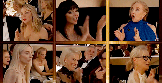 Smiling now, Elizabeth gets to her feet - although Gillian Anderson was first to shout 'woo!' and jump up to applaud.