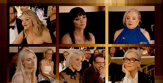 With all nominees pictured in small windows, Elizabeth Debicki is named winner. Elizabeth blinks in surprise.